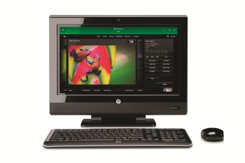HP TouchSmart 310 PC, front view, with wireless keyboard and mouse