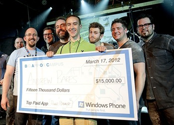 Microsoft's Ben Lower presents Big App on Campus Grand Prize winners with a big check.