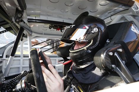 Driver Alex Bowman inputs performance results on his Surface Pro