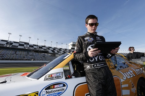 Driver Alex Bowman checks performance results on his Surface Pro before his qualifying run.