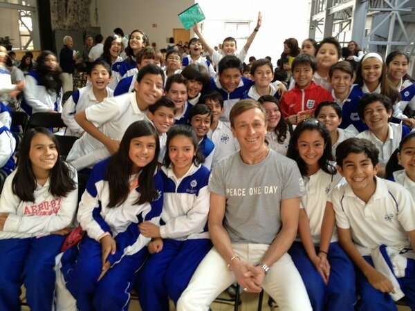 Peace One Day Founder Jeremy Gilley poses with students in Mexico City, Mexico.