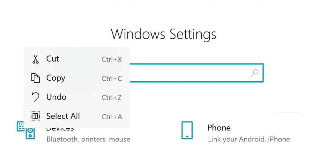 Casella di ricerca Impostazioni di Windows, il testo "test" è stato selezionato e fatto clic con il tasto destro, mostrando un menu di comando con taglia / copia / annulla / seleziona tutto con icone e tasti di scelta rapida informativi.