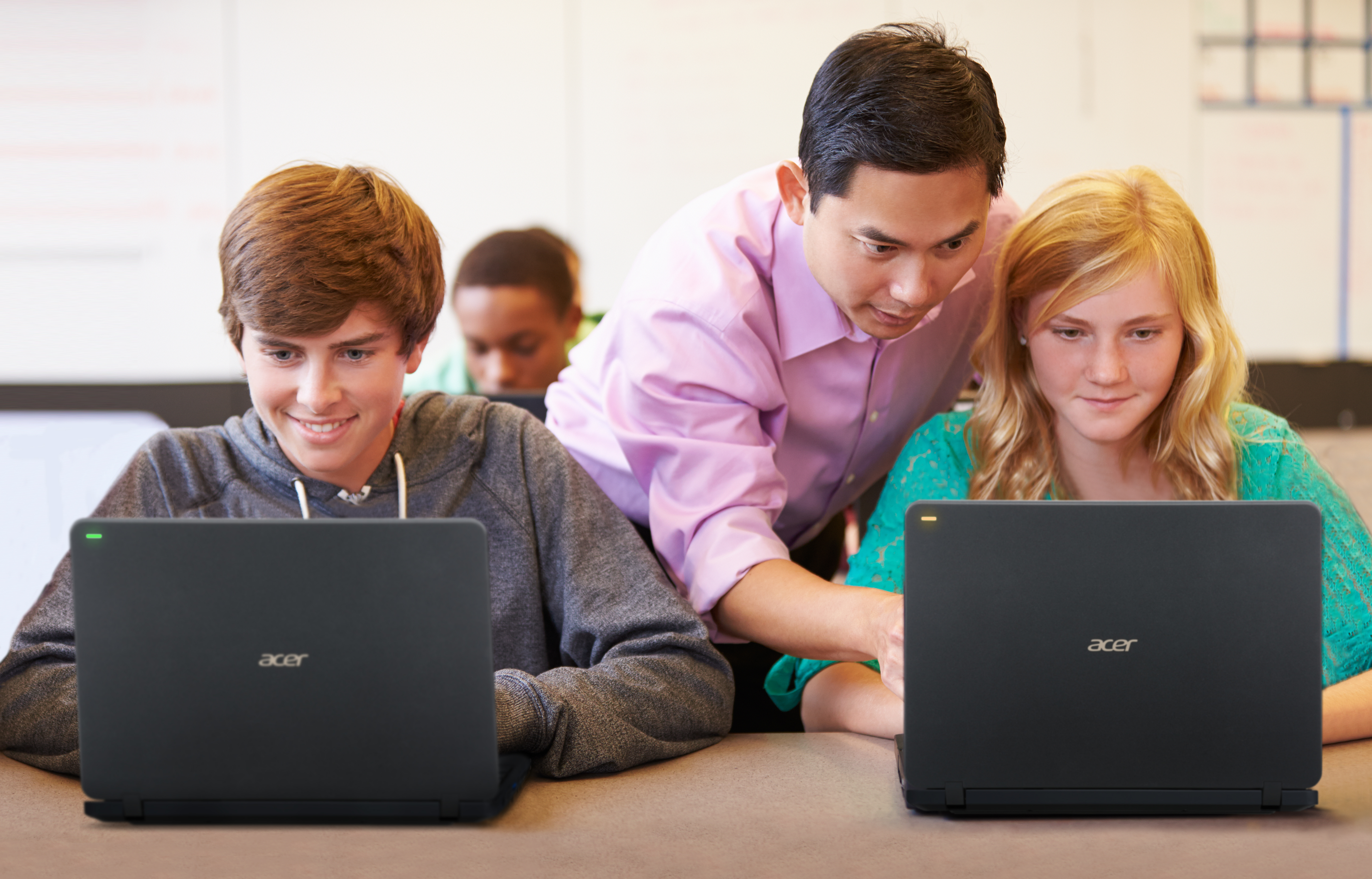 The Acer TravelMate B117 in the classroom, with the LED light embedded on the lid students can signal with the light for assistance from their teacher.