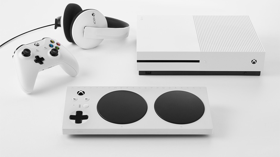 Photo of white Xbox Adaptive Controller, Xbox One X console, Xbox controller and headphones