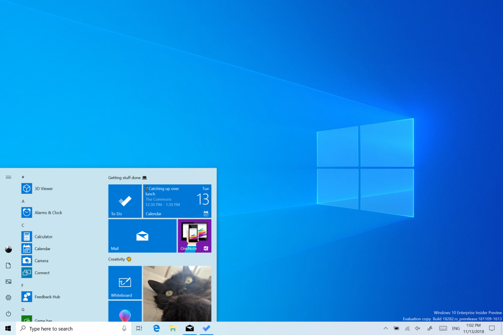 Full screen screenshot showing the Start menu open in light theme, as well as the taskbar. A new Windows wallpaper is visible, with the Windows logo