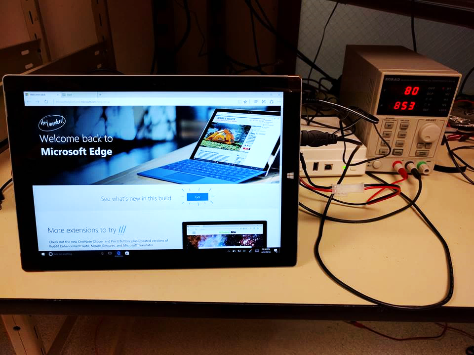 Photo of a Surface Pro 3 attached to instantaneous power consumption equipment.