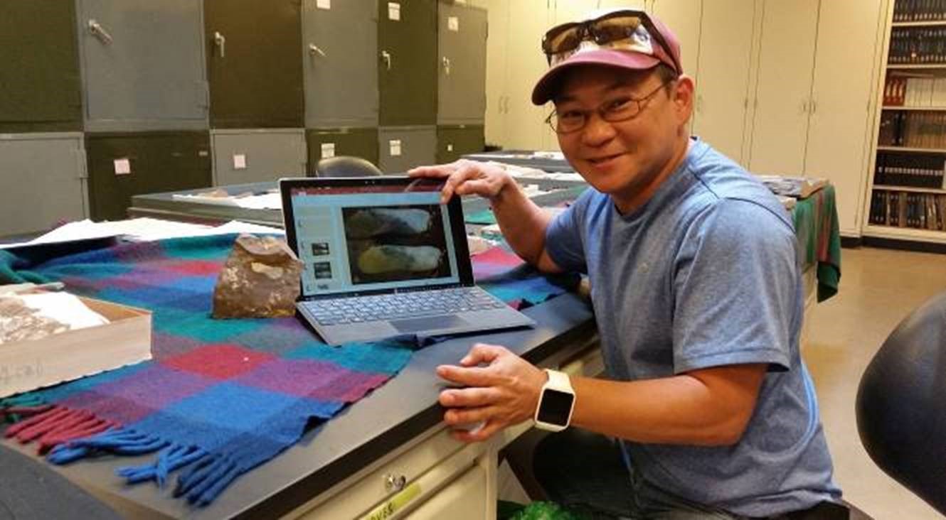 Working in Kathleen Pigg’s Ph.D. Lab, Soon is blowing up a photo to examine the smaller details such as venation and margins on the acer samaras fossil then adding it to his PDF presentation for National Fossil Day in Republic Washington.  