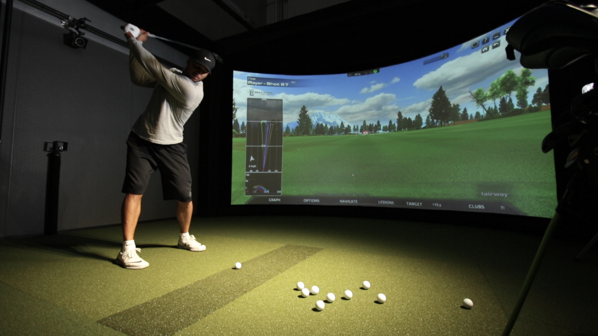 At the Gregg Rogers Golf Performance Centers, a student takes shots in a controlled, indoor, simulated golf environment where “The Gregg Rogers Golf Performance” Windows 10 UWP training app integrates with the golf simulators and cameras to record data from his shot such as body mechanics, club-head speed and swing angle.