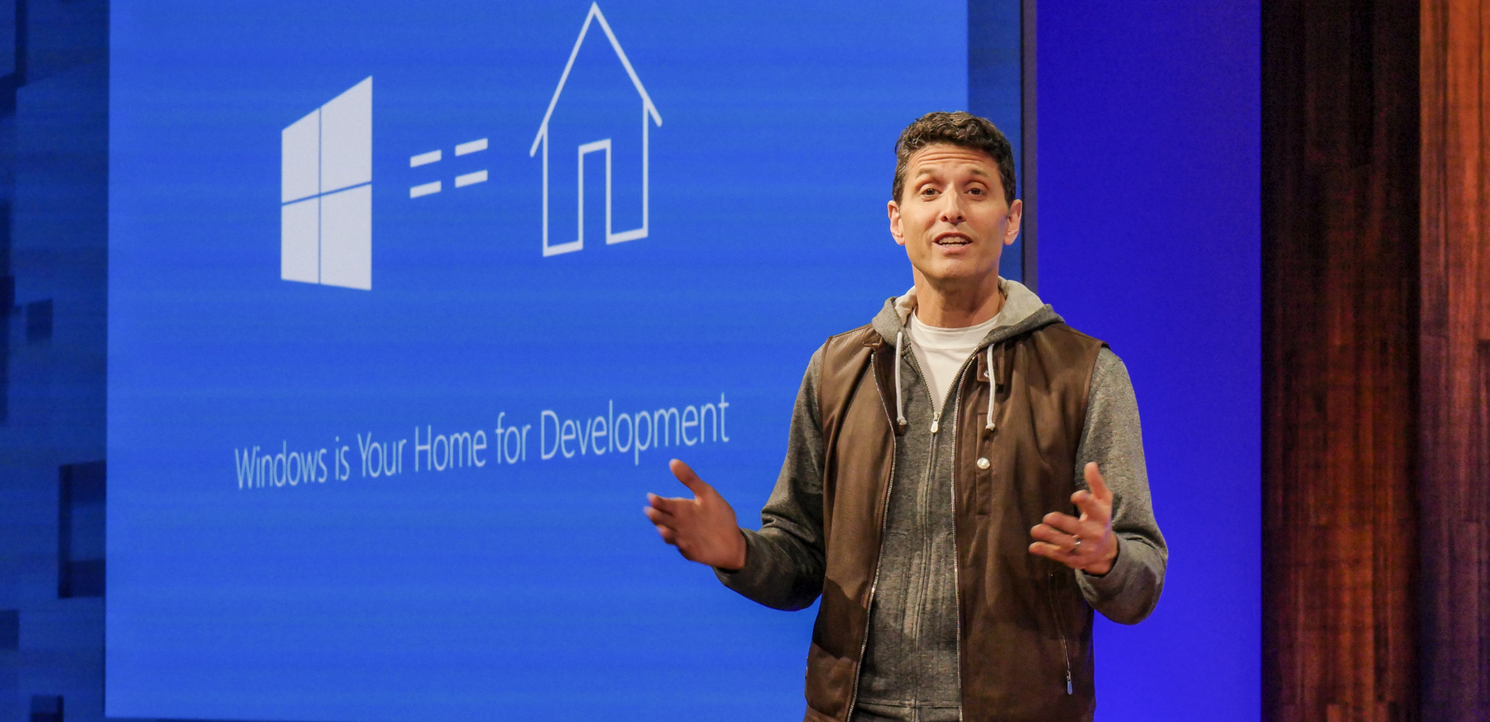Terry Myerson, executive vice president of the Windows and Devices Group, Microsoft, standing on stage speaking at Build 2017.