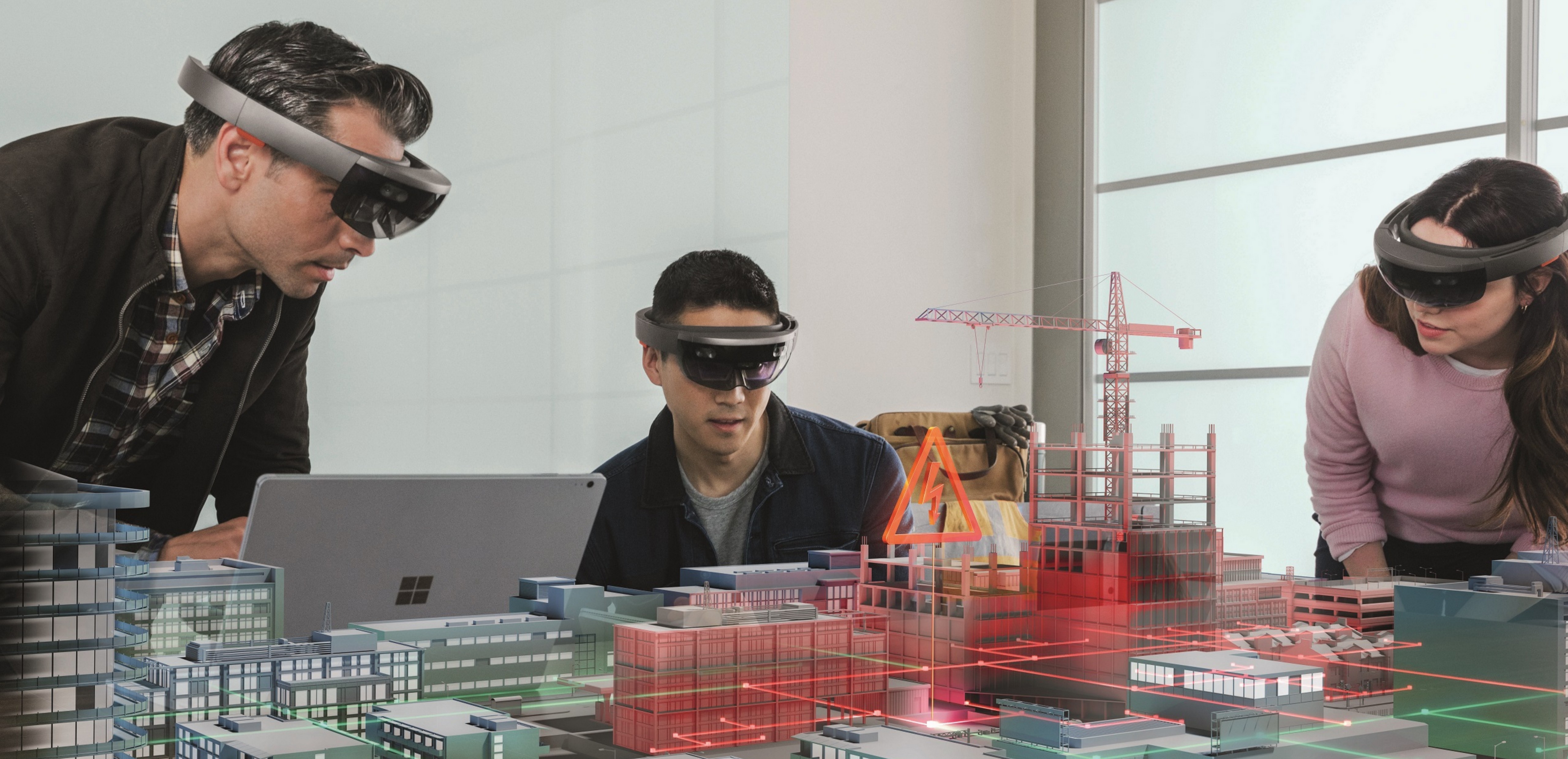Three people wearing Microsoft HoloLens in a room.