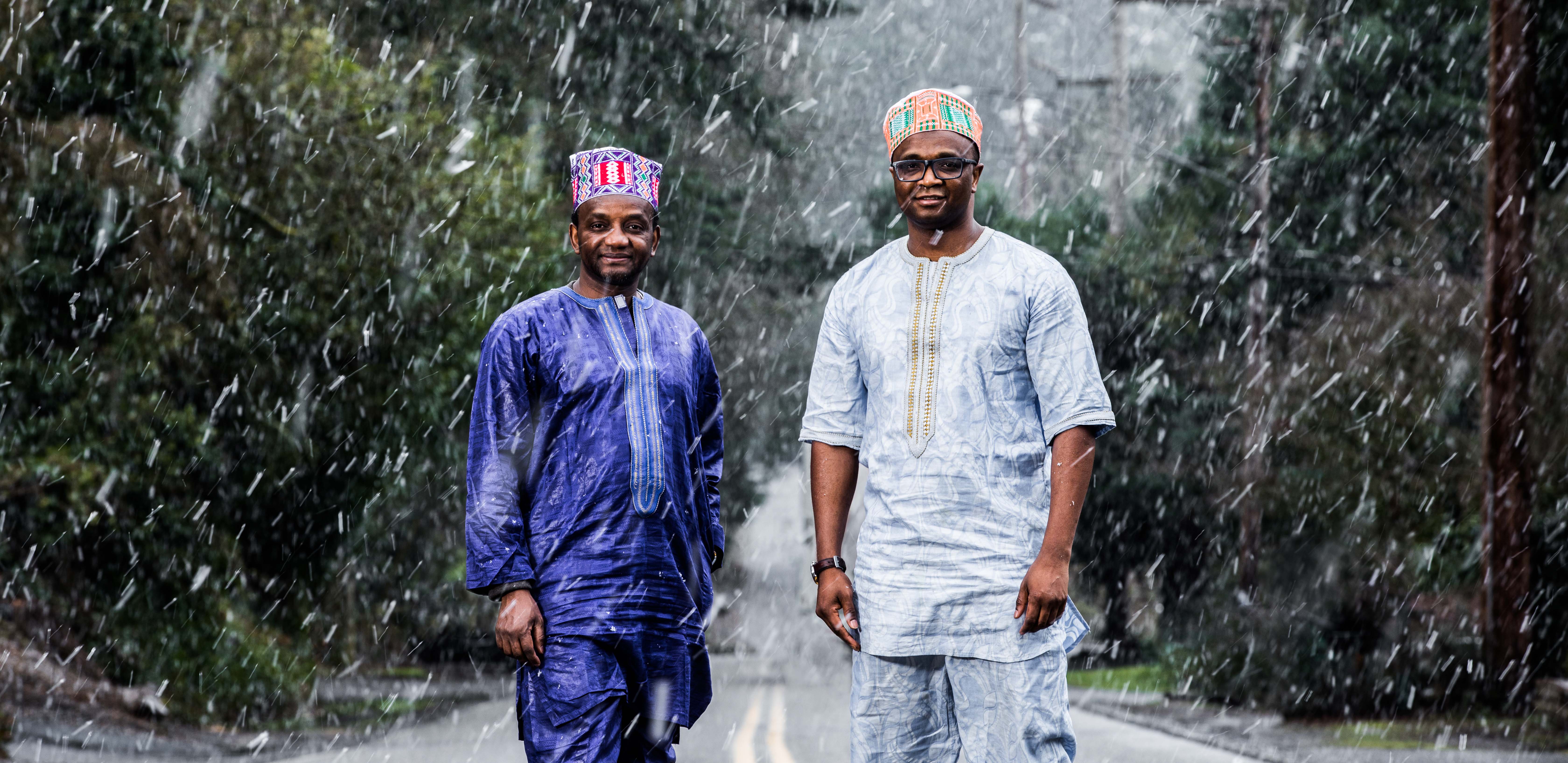ADLaM creators Ibrahima and Abdoulaye Barry photographed in the rain