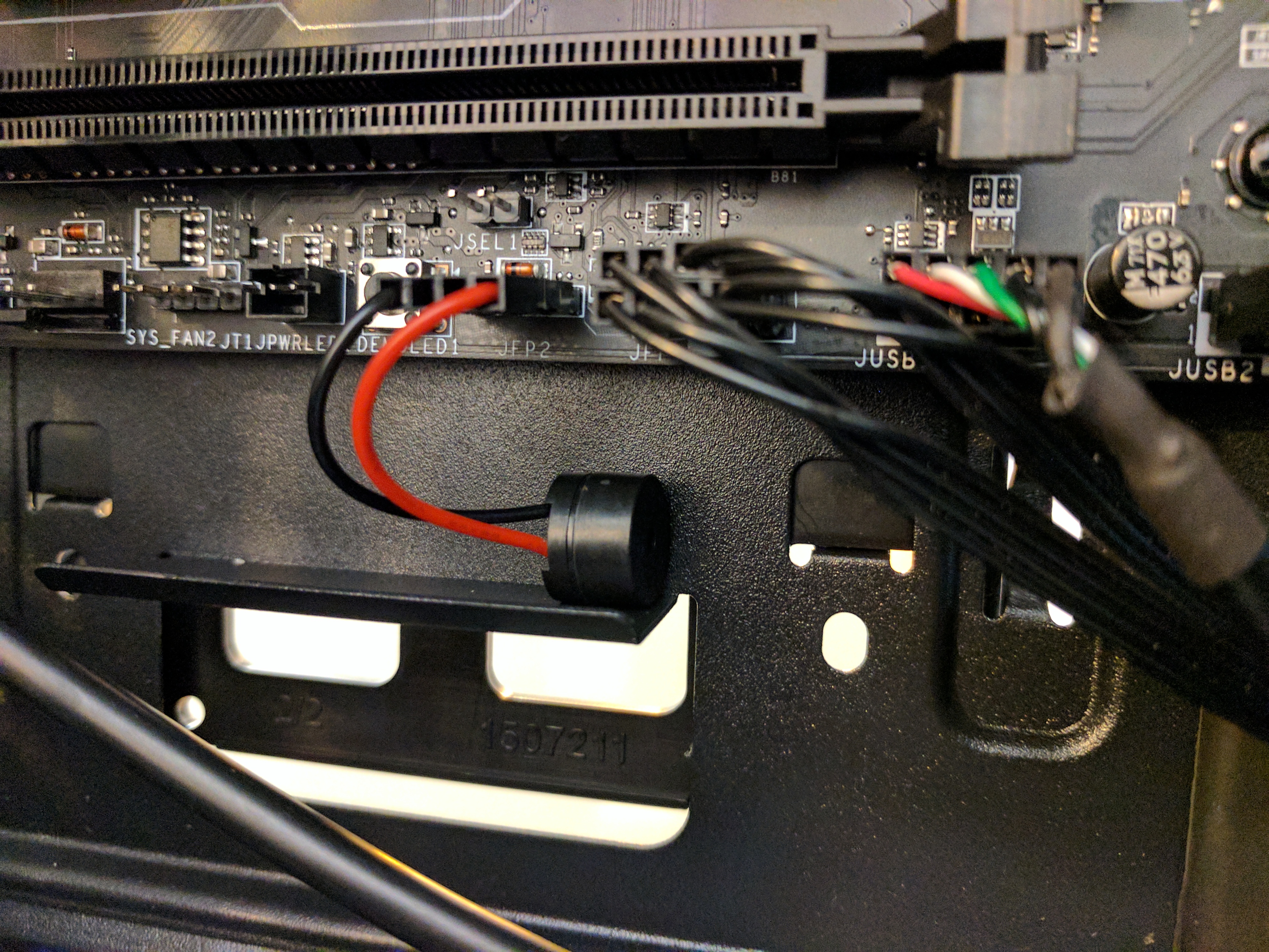 Attaching up the case header pins, some fan plugs, and of course… the speaker!
