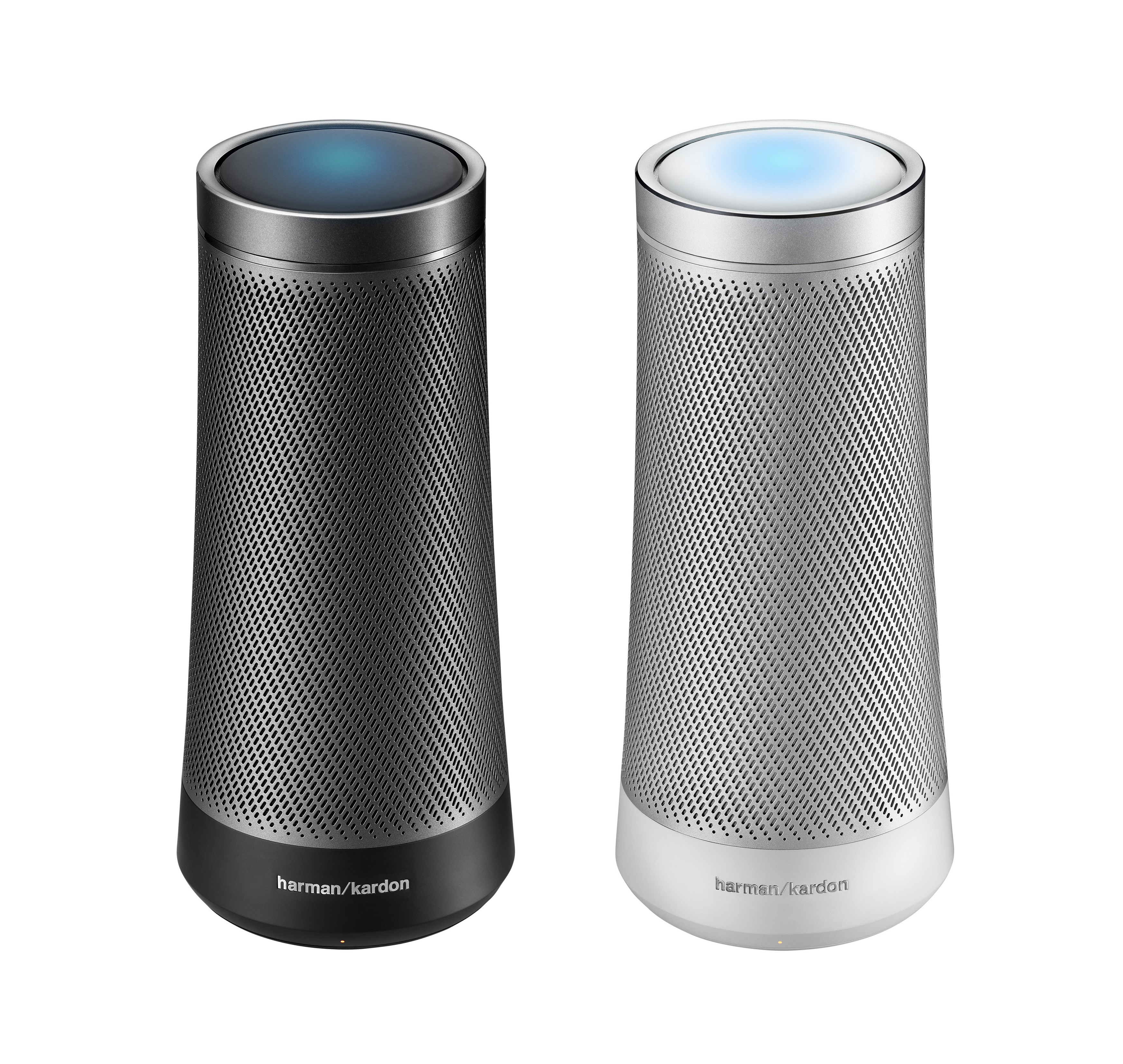 Product shot of two Harman Kardon Invoke speakers on a white background side by side, one is black in color and the other is white.