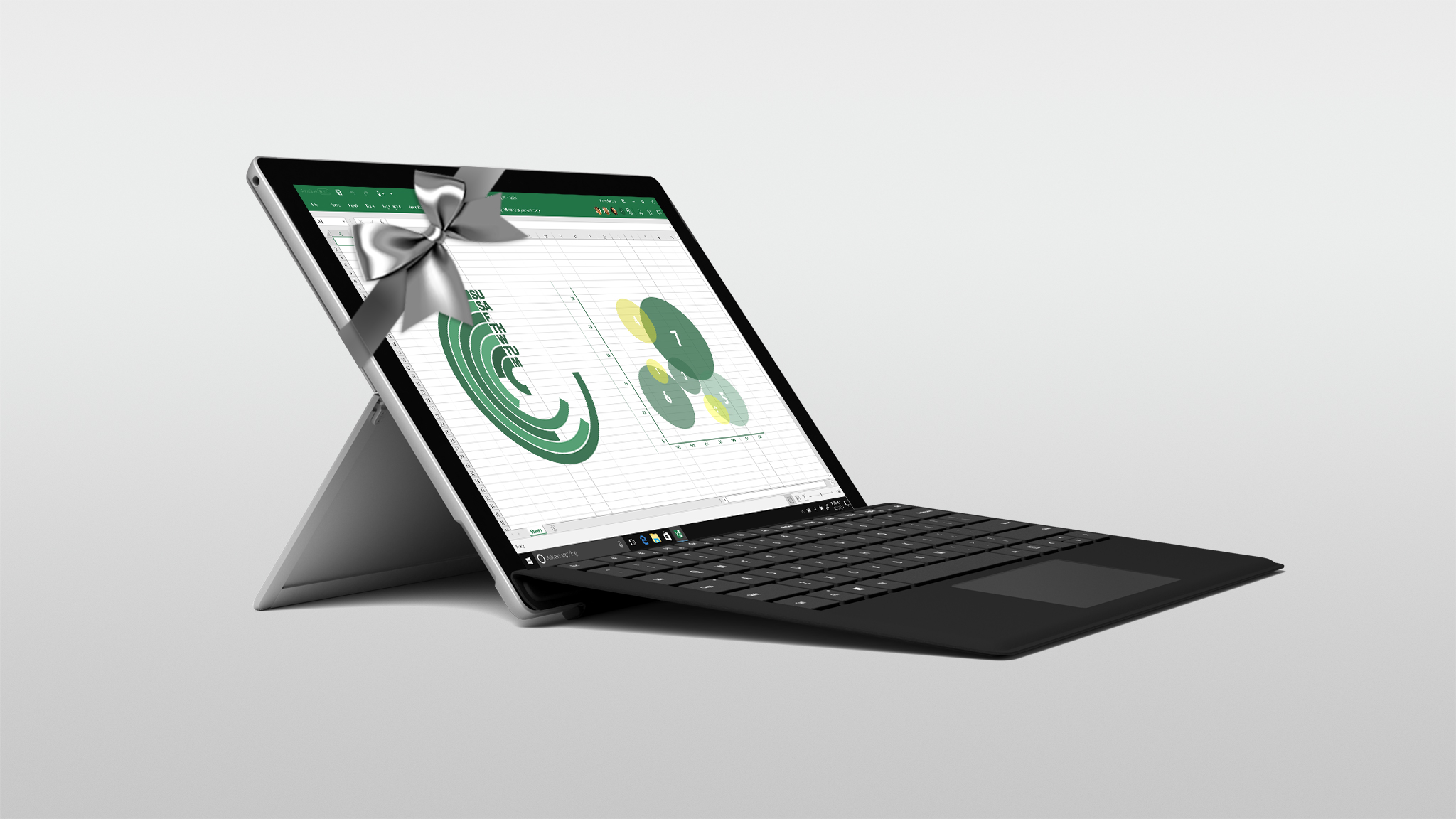 The new Surface Pro wrapped in a silver bow with Excel shown on the screen.