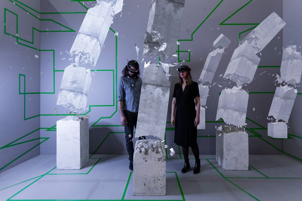 Studio Drift founders Lonneke Gordijn and Ralph Nauta view their original HoloLens work, Concrete Storm