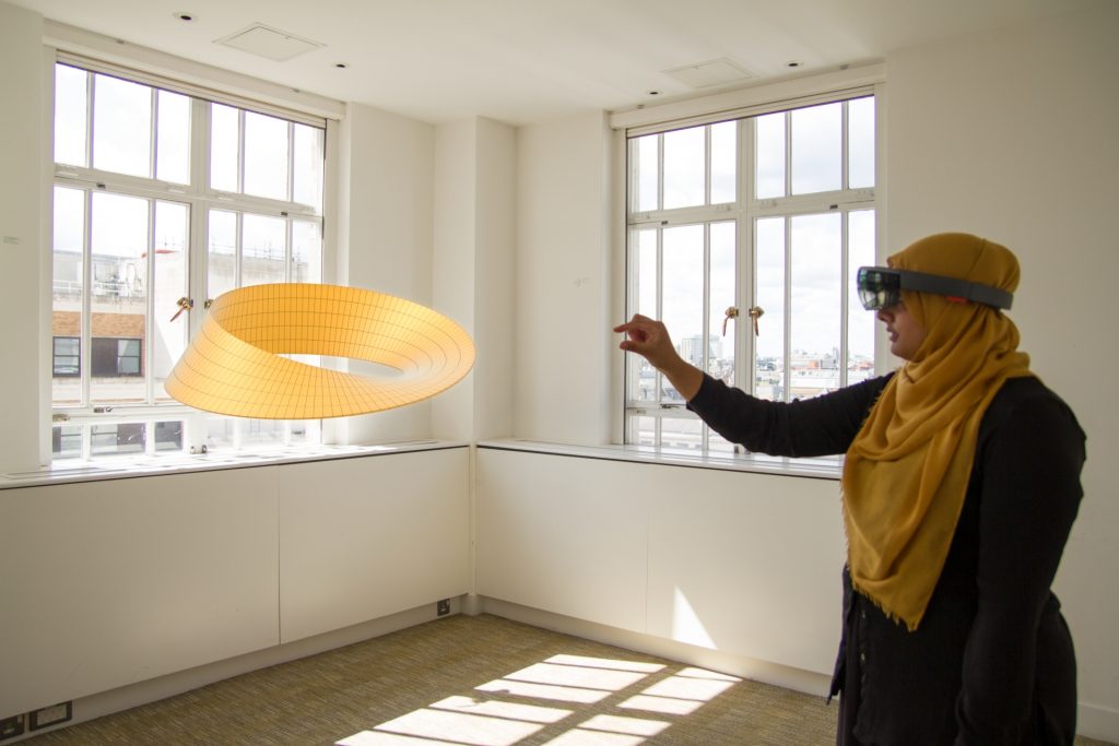 Woman wearing Microsoft HoloLens.