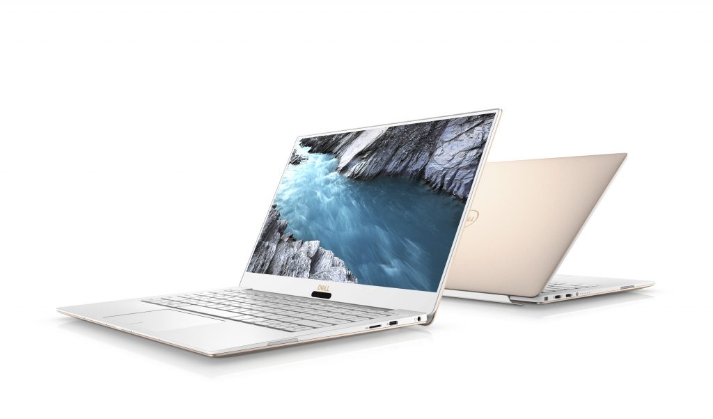 Product shot of two Dell XPS PCs sitting back to back on a white background
