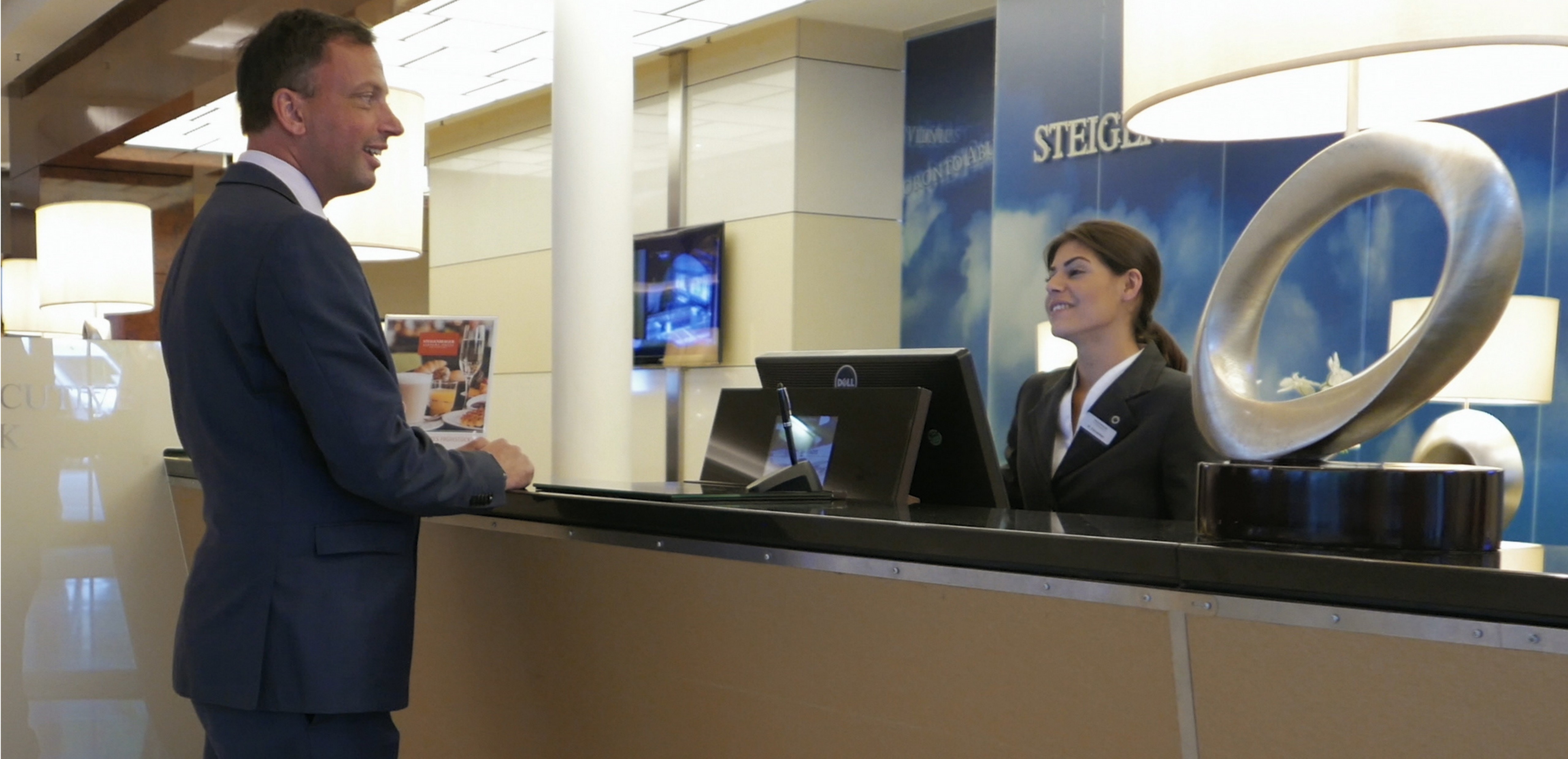 A Steigenberger Airport Hotel employee uses the new IoT wearable called Smartagent by Trekstor and powered by Windows IoT Core and the Microsoft Azure IoT to help them optimize their back-of-house operations and ensure a superior guest experience.