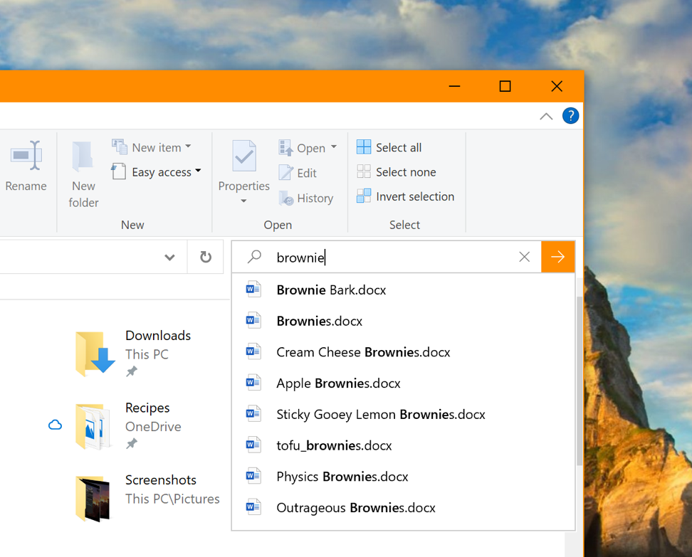 Showing the new dropdown that appears when you type in File Explorer’s search box.