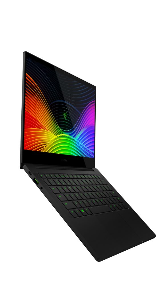 Photo of the Razer Blade Stealth 13, open and facing right with colorful waves on the screen, green backlit keyboard