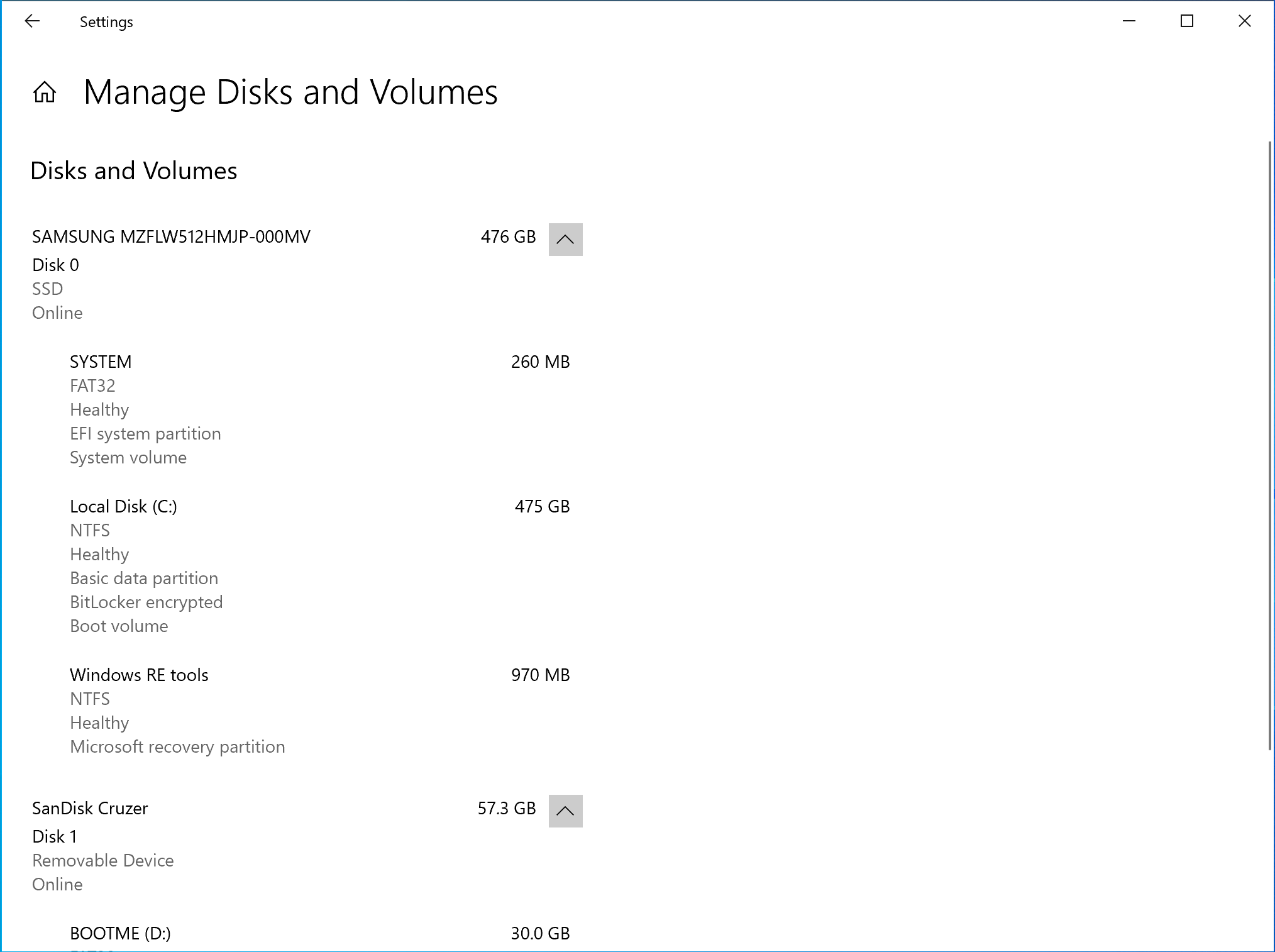 The Manage Disks and Volumes page in Settings. C drive is selected and shows Explorer and Properties options.
