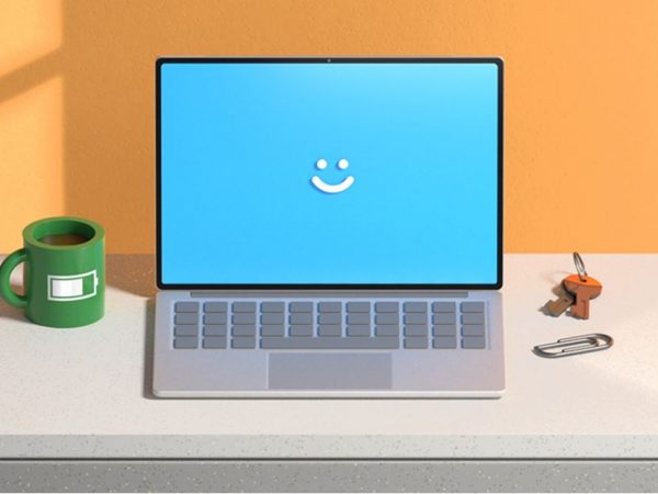 Computer with Windows Hello smile displayed