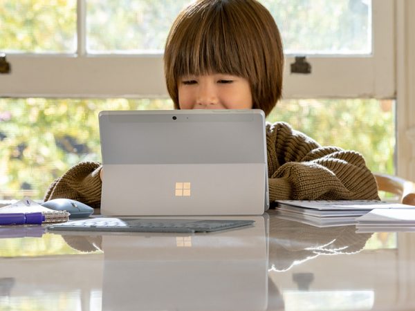 Child interacting with a Surface Go 2 device