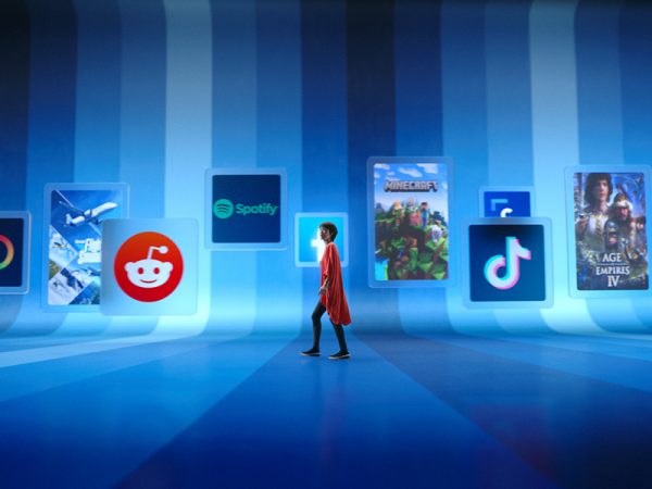 Woman walking past Microsoft Store app icons