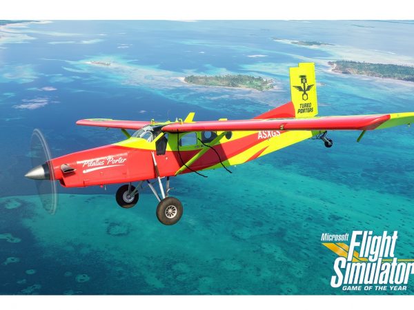 Small red and yellow airplane flying above water