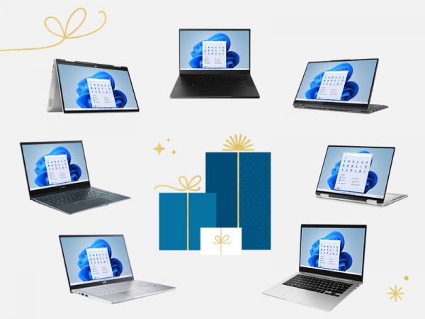 Holiday gift packages surrounded by seven laptop computers
