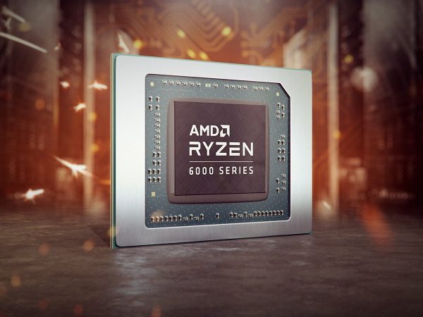 AMD Ryzen processor angled to the right with reddish background