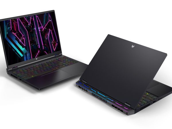 Two gaming laptops open on a flat surface