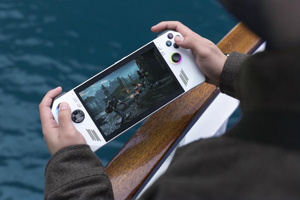 Handheld console held in someone's hand