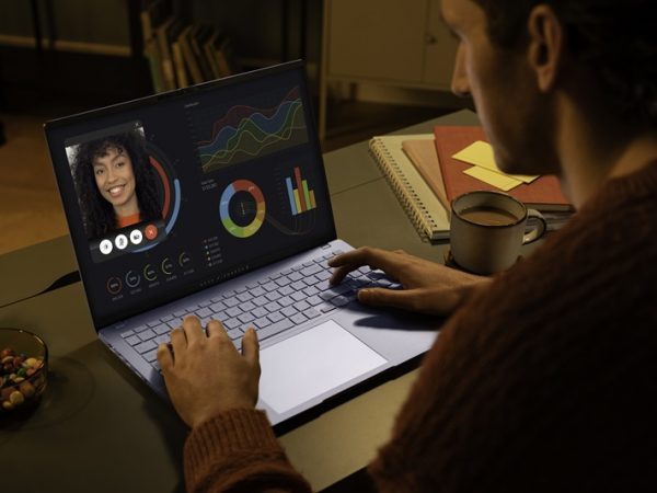 Man looking at woman on laptop screen