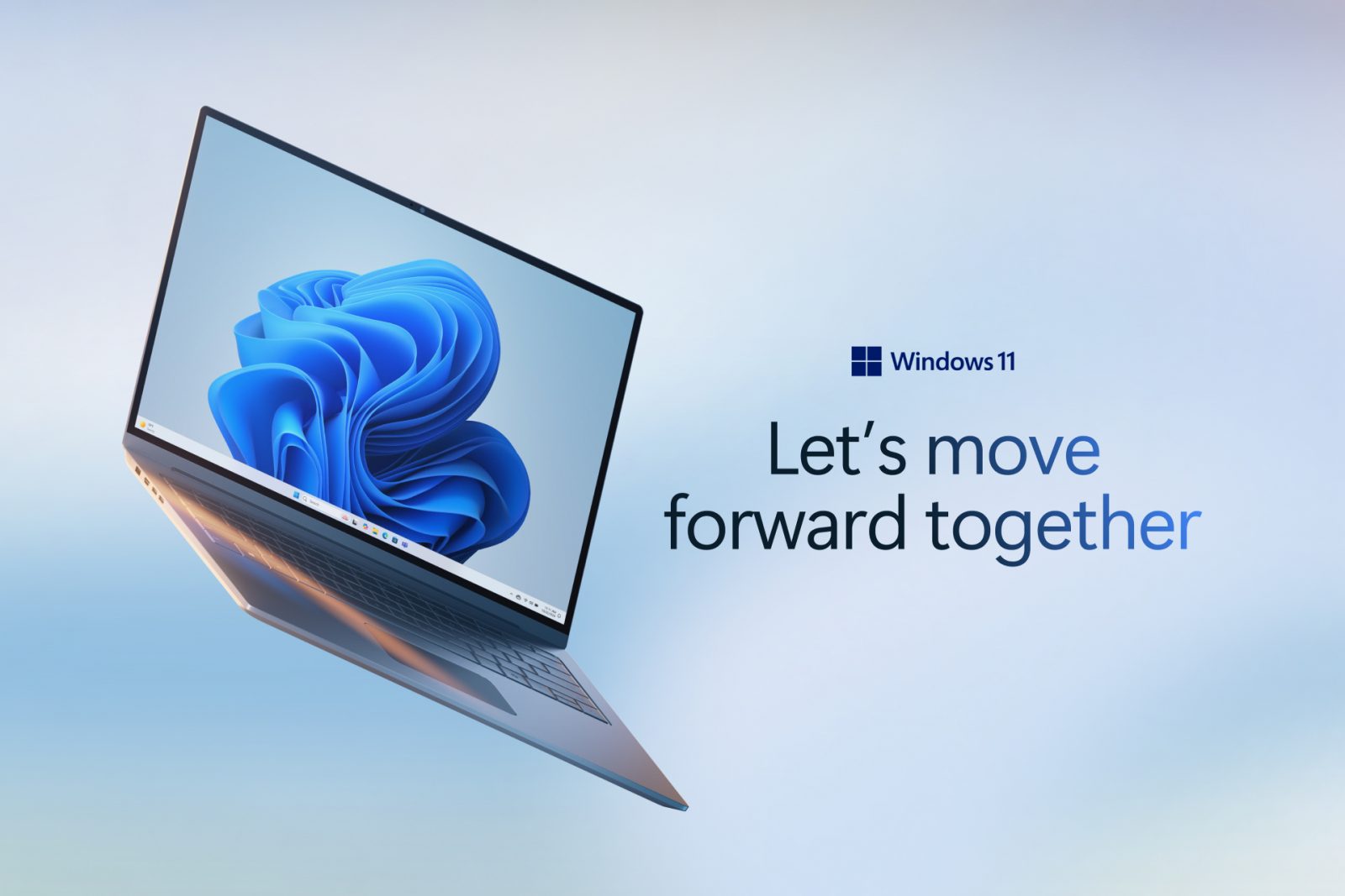 Laptop running Windows 11 along with the words Let's move forward together