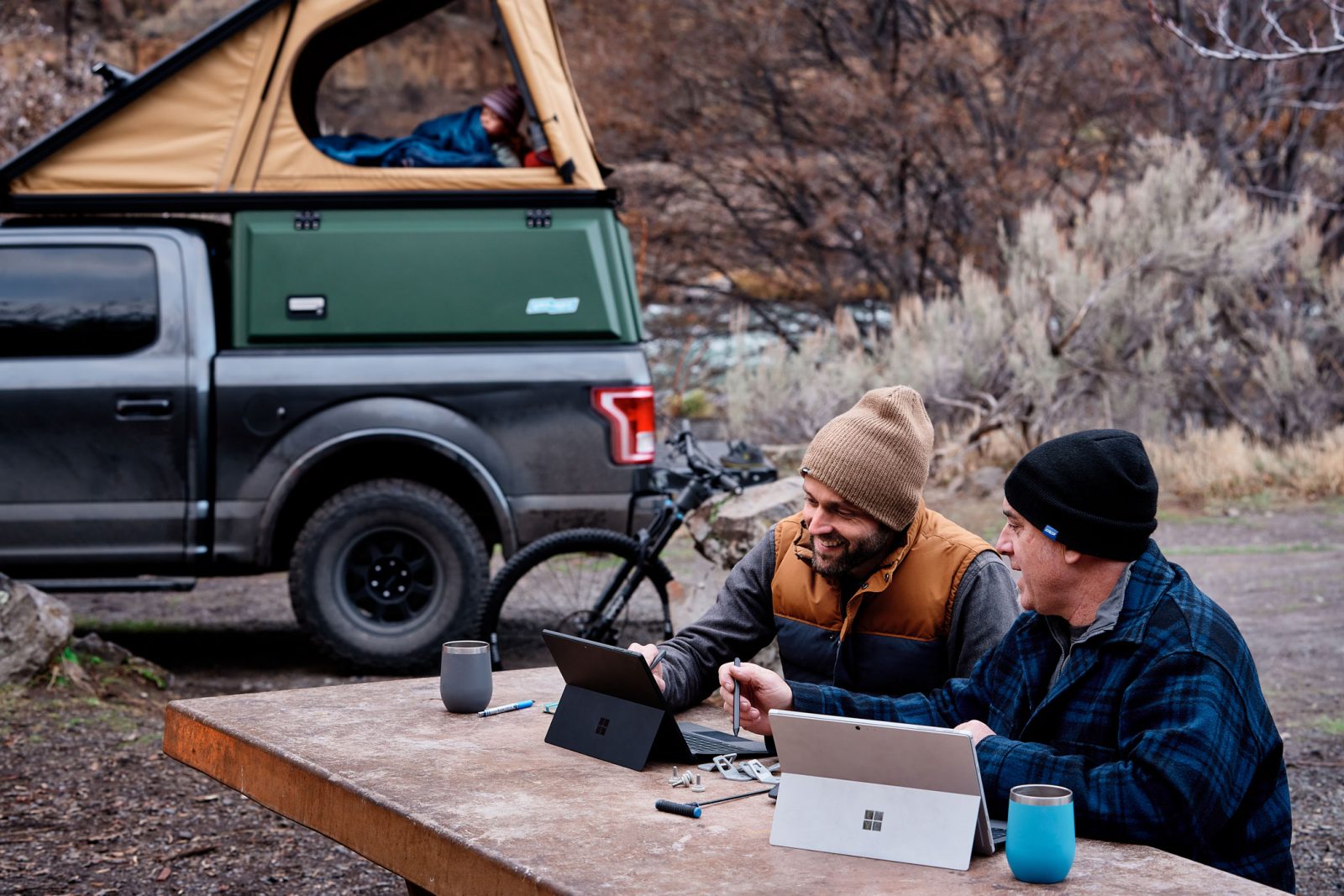 Two campers using Surface devices
