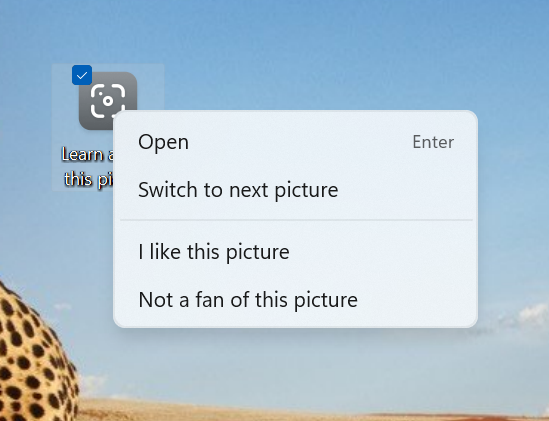デスクトップのSpotlightアイコンを右クリックして、Spotlight画像を切り替えるか、画像が好きか嫌いかを教えてください。