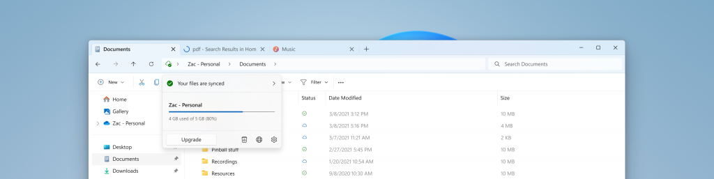 Modernized address bar in File Explorer with OneDrive sync and quota flyout.
