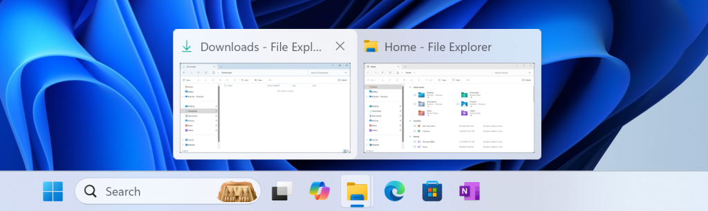 Pratinjau bilah tugas yang diperbarui ditampilkan untuk dua jendela File Explorer yang terbuka.